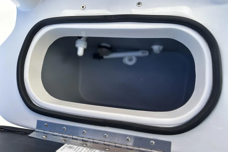 Slide: The Image of Open storage compartment of Avid 207 Recon 2026, featuring a secure latch and gasket seal. - 21