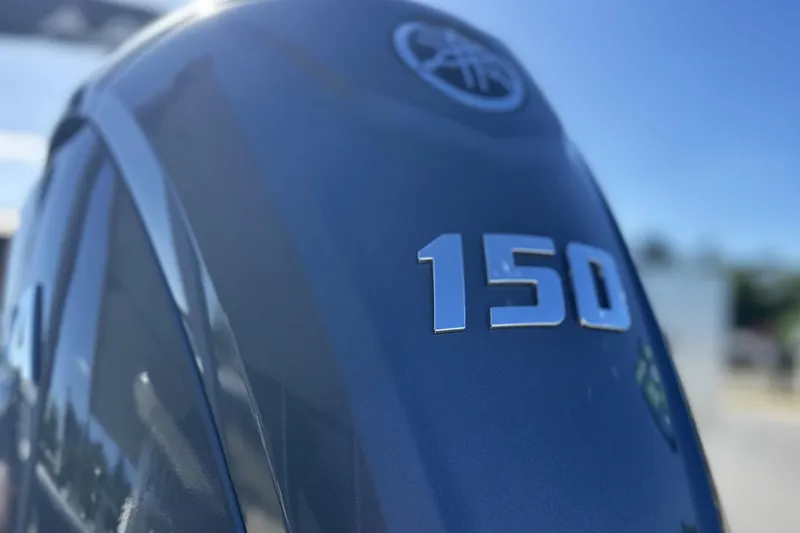 Slide: The Image of Close-up of Avid 207 Recon 2026 boat engine with "150" emblem. - 5