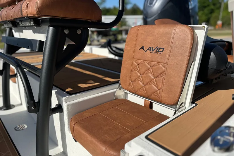 Slide: The Image of Brown leather seating on 2026 Avid 207 Recon boat, featuring stylish design and comfort. - 7