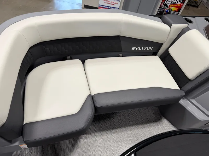 Slide: The Image of The image shows an elegant, cushioned seating area in a Sylvan boat, model R-20 Q DH, year 2027. - 5