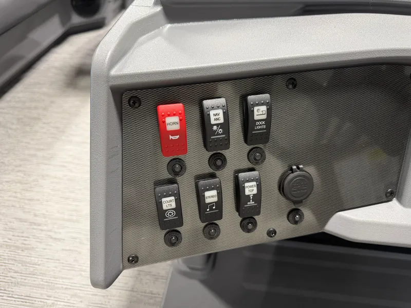 Slide: The Image of Close-up of a boat control panel with various switches and a charging port. - 11