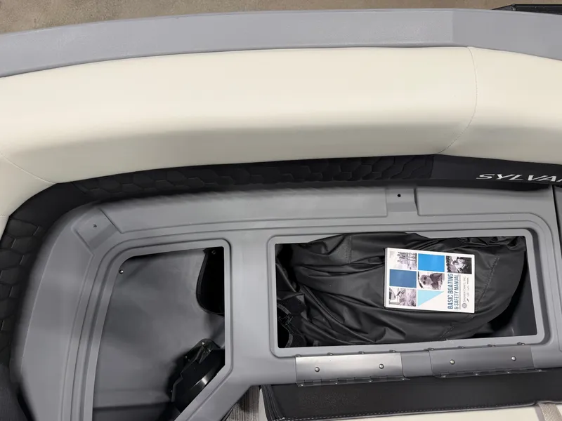 Slide: The Image of The image shows a bench seat with storage underneath, containing a bag and a brochure. - 6