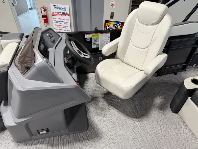Slide: The Image of The image shows the helm of a 2027 Sylvan R-20 Q DH with a comfortable white seat. - 9