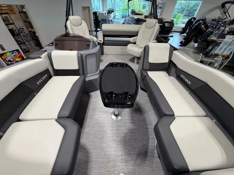 Slide: The Image of Interior of a 2027 Sylvan R-20 Q DH with luxurious seating and a central table. - 4