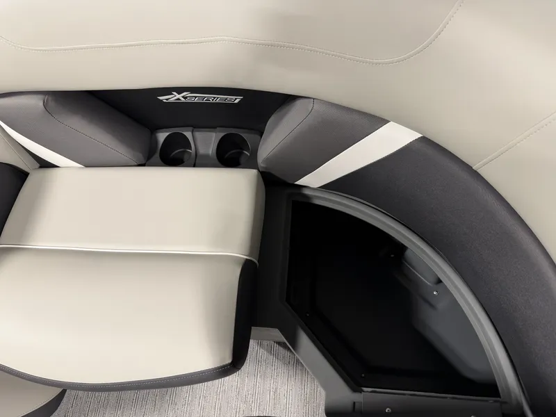 Slide: The Image of Sleek, modern seating with integrated storage and cup holders on a Sylvan boat. - 11