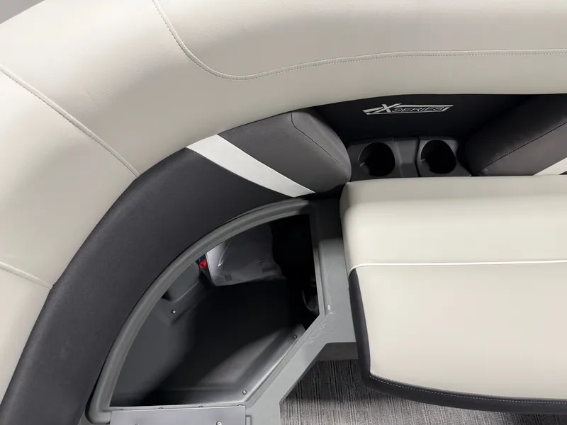 Slide: The Image of Interior view of a 2026 Sylvan MIRAGE X3 DLZ BAR with gray and white upholstery. - 9