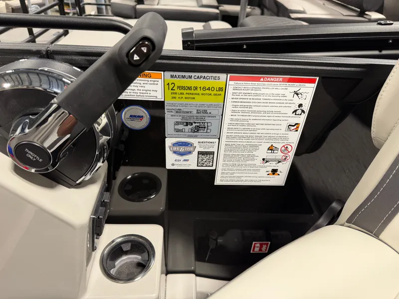 Slide: The Image of Close-up of a Sylvan MIRAGE X3 DLZ BAR helm with capacity labels and cup holders. - 18