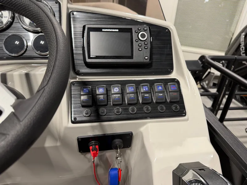 Slide: The Image of The image shows the dashboard of a Sylvan MIRAGE X3 DLZ BAR with a Humminbird device and multiple switches. - 17