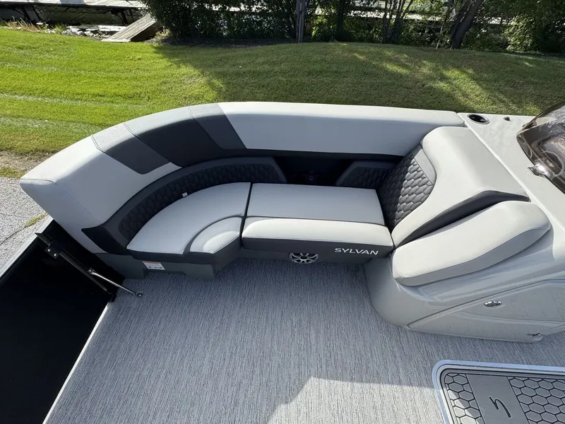 Slide: The Image of The image shows a sleek gray seating area on a 2026 Sylvan L3 DLZ boat. - 23