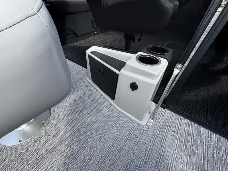 Slide: The Image of A sleek gray interior with a cup holder and a small storage compartment. - 18