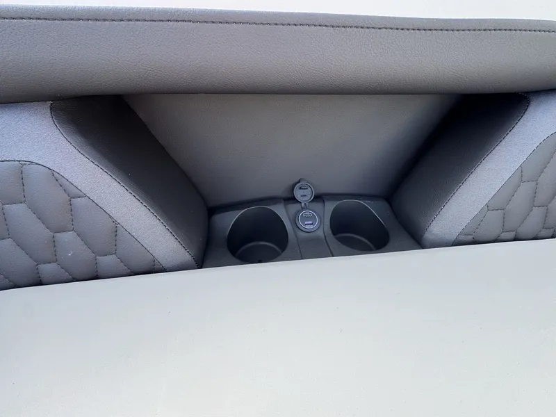 Slide: The Image of The rear seat of a 2026 Sylvan L3 DLZ with cup holders and a USB port. - 25