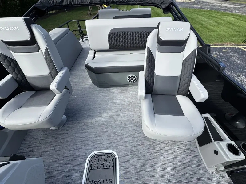 Slide: The Image of The image shows the interior of a 2026 Sylvan L3 DLZ with gray and black seating. - 17