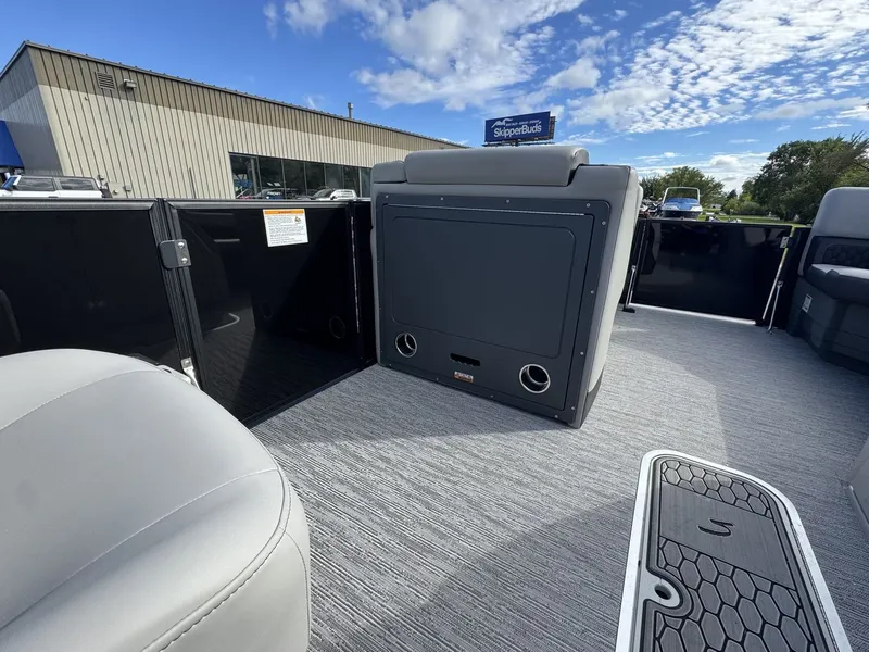 Slide: The Image of The image shows the interior of a 2026 Sylvan L3 DLZ with gray seating and carpeted flooring. - 19