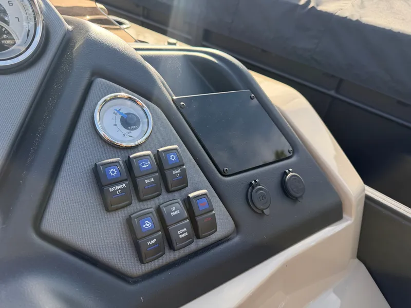 Slide: The Image of The dashboard of a 2026 Sylvan L3 DLZ with various switches and a speedometer. - 22