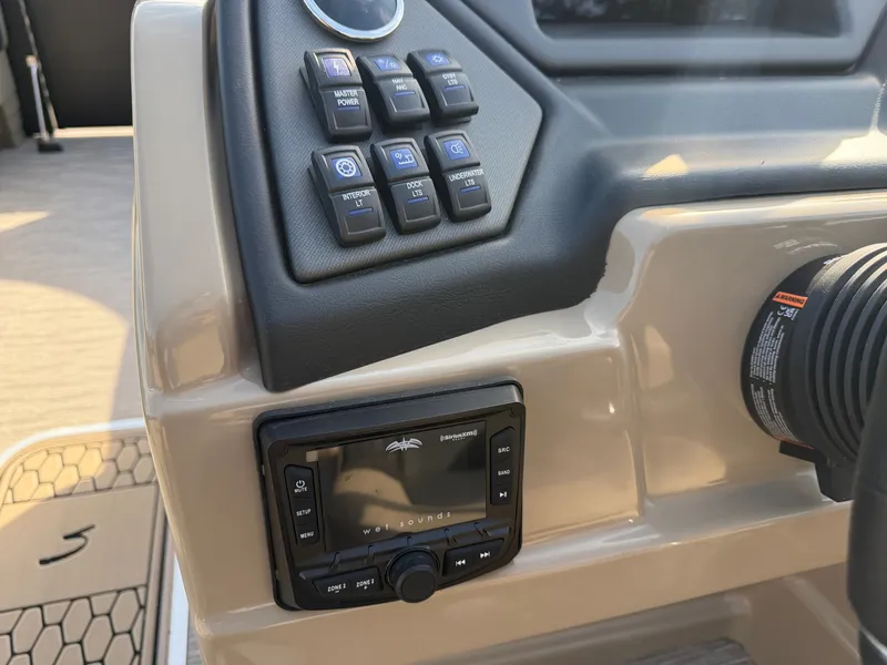 Slide: The Image of The image shows the dashboard of a Sylvan L3 DLZ boat with various controls. - 19