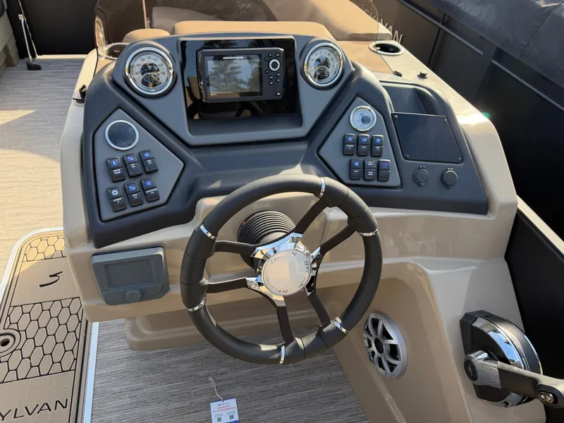 Slide: The Image of The dashboard of a 2026 Sylvan L3 DLZ with steering wheel and controls. - 18