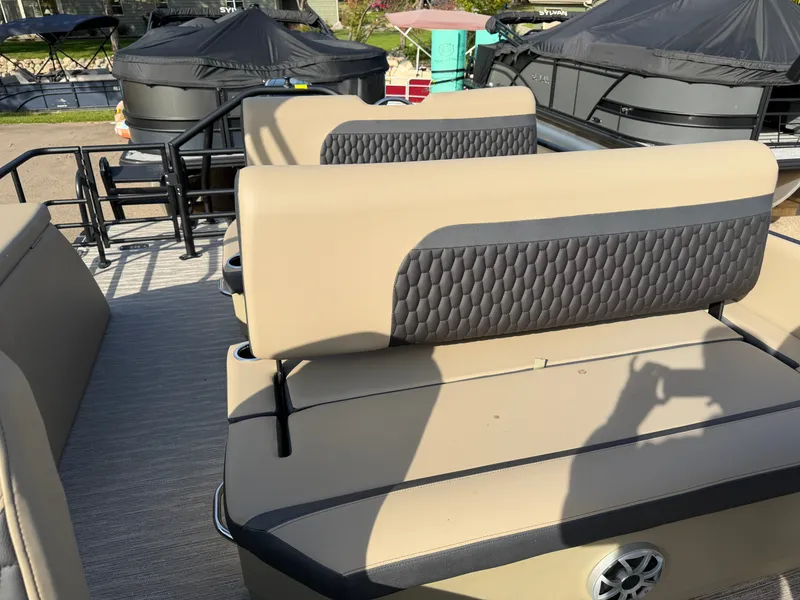Slide: The Image of The image shows the seats of a Sylvan L3 DLZ pontoon boat with cushioned backrests. - 27