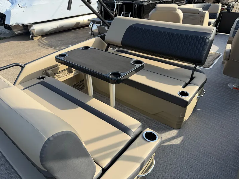 Slide: The Image of The image shows the interior of a 2026 Sylvan L3 DLZ with beige seating and a table. - 24