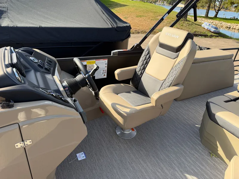 Slide: The Image of The image shows the helm of a 2026 Sylvan L3 DLZ with a beige captain's chair. - 17