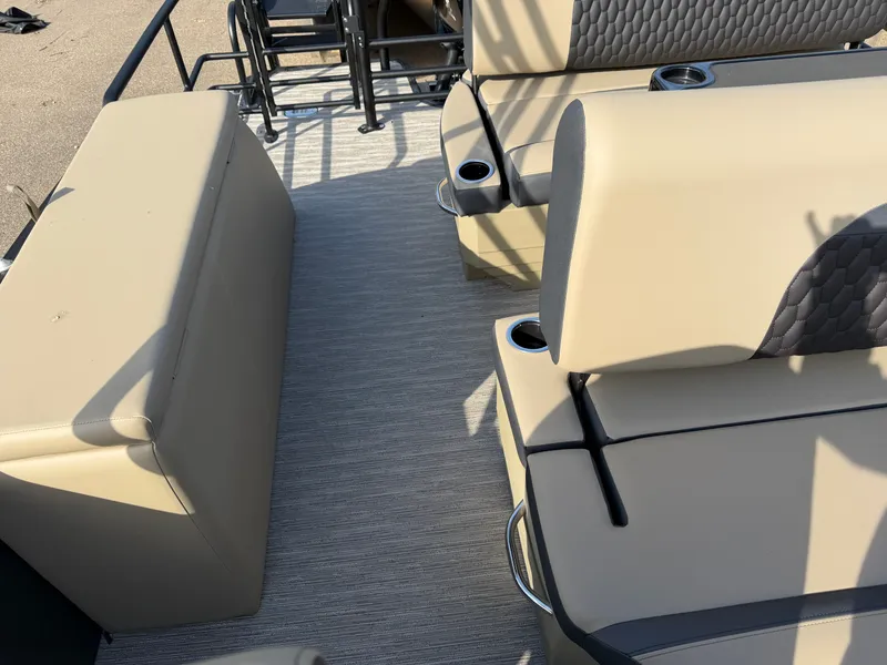 Slide: The Image of The image shows the seating of a Sylvan L3 DLZ pontoon boat with beige upholstery. - 26