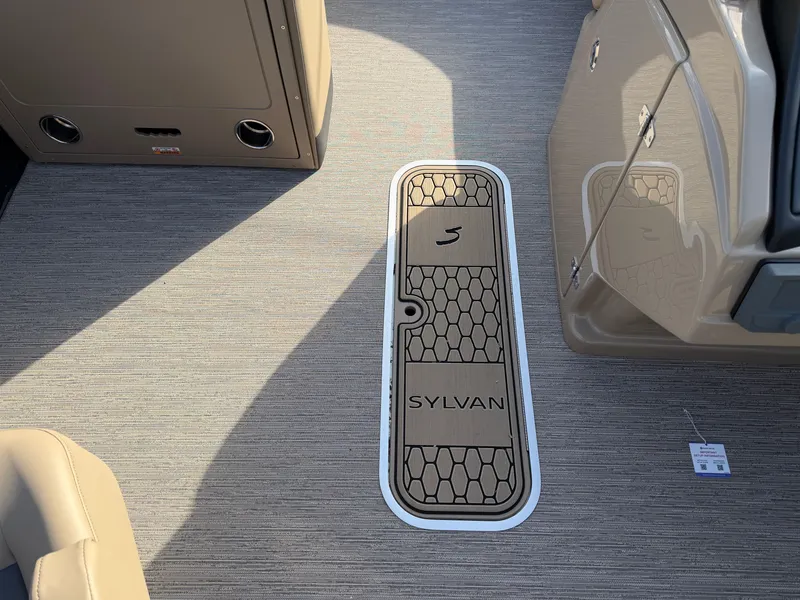 Slide: The Image of The floor of a Sylvan L3 DLZ boat with a stylish design and Sylvan logo. - 15