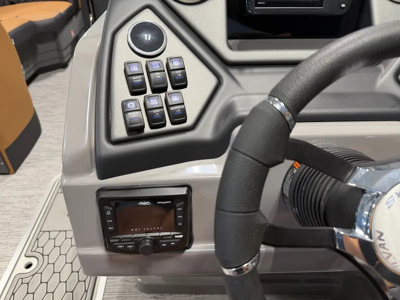 Slide: The Image of The image shows the helm of a Sylvan L3 DLZ boat with controls and a steering wheel. - 15