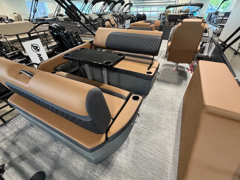 Slide: The Image of The image shows the interior of a 2026 Sylvan L3 DLZ with luxurious seating and a table. - 25