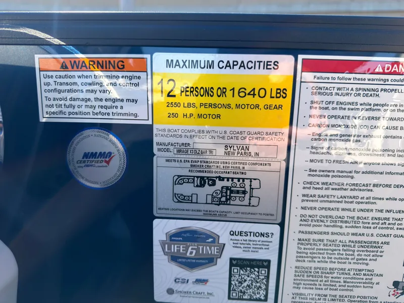 Slide: The Image of Warning labels and capacity information on a Sylvan boat. - 44