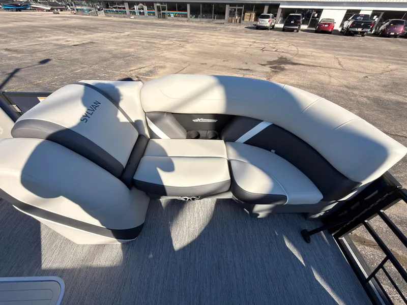 Slide: The Image of The image shows a modern, cushioned seating area on a boat, surrounded by an open deck. - 12