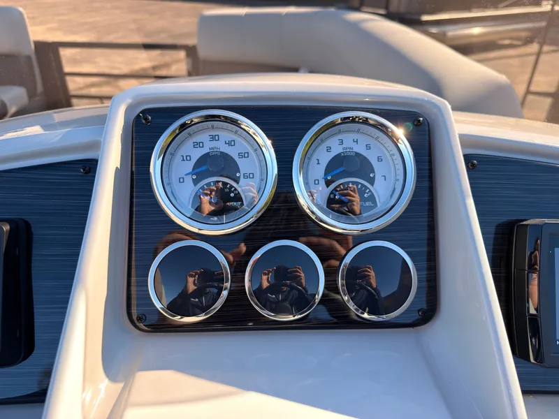 Slide: The Image of Dashboard of a Sylvan MIRAGE X3 DLZ BAR with speedometer and tachometer. - 38