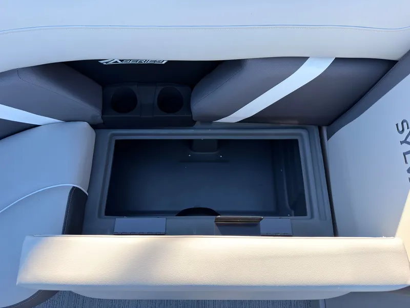 Slide: The Image of Interior view of a Sylvan MIRAGE X3 DLZ BAR with cushioned seats and cup holders. - 23