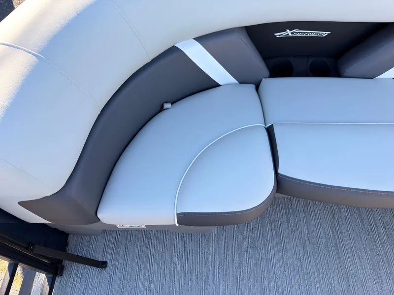 Slide: The Image of The 2026 Sylvan MIRAGE X3 DLZ BAR features an elegant, cushioned bench with a gray and white design. - 20