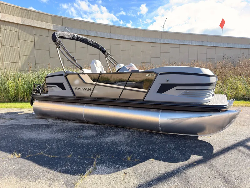 The Image of A modern Sylvan pontoon boat, model R-20 Q DH, year 2027, parked on a lot. - 0