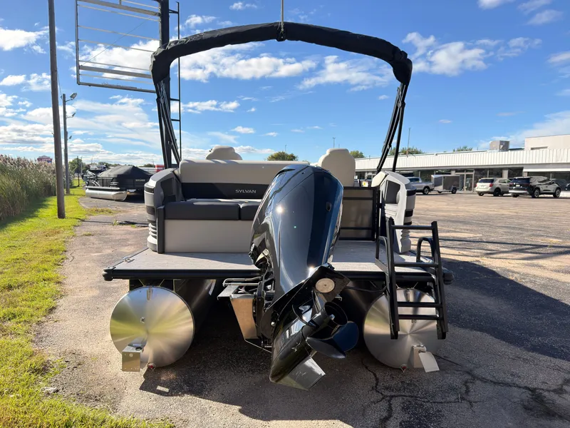 Slide: The Image of The image shows a 2027 Sylvan R-20 Q DH pontoon boat. It is parked under a blue sky. - 3