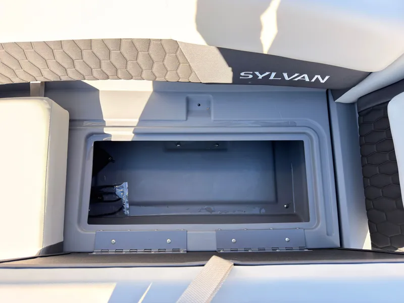 Slide: The Image of The image shows a storage compartment on a Sylvan boat, model R-20 Q DH, year 2027. - 20
