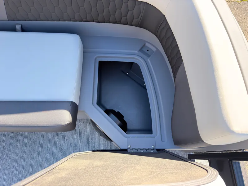 Slide: The Image of The image shows the seating area of a 2027 Sylvan R-20 Q DH with storage underneath. - 12