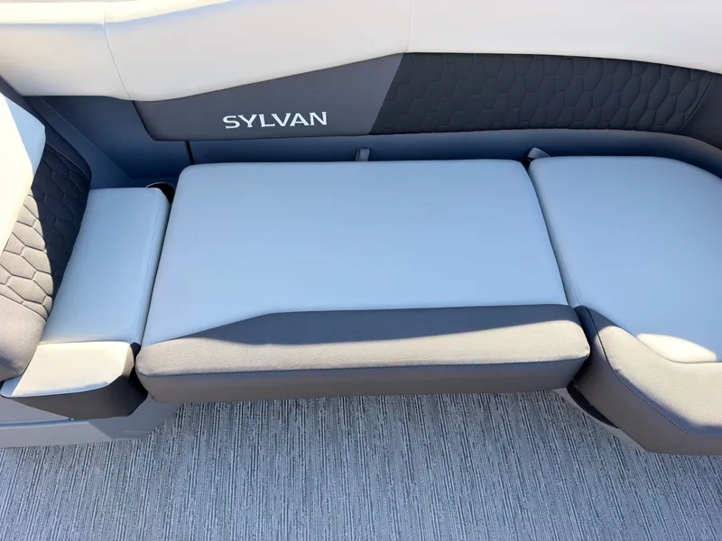 Slide: The Image of The 2027 Sylvan R-20 Q DH features a stylish, cushioned bench seat with a modern design. - 13