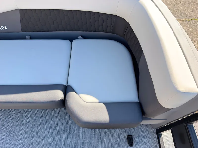 Slide: The Image of The 2027 Sylvan R-20 Q DH features an elegant, cushioned bench with gray and white upholstery. - 11