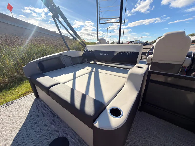 Slide: The Image of The image shows the rear seating area of a 2027 Sylvan R-20 Q DH boat with comfortable seating. - 40