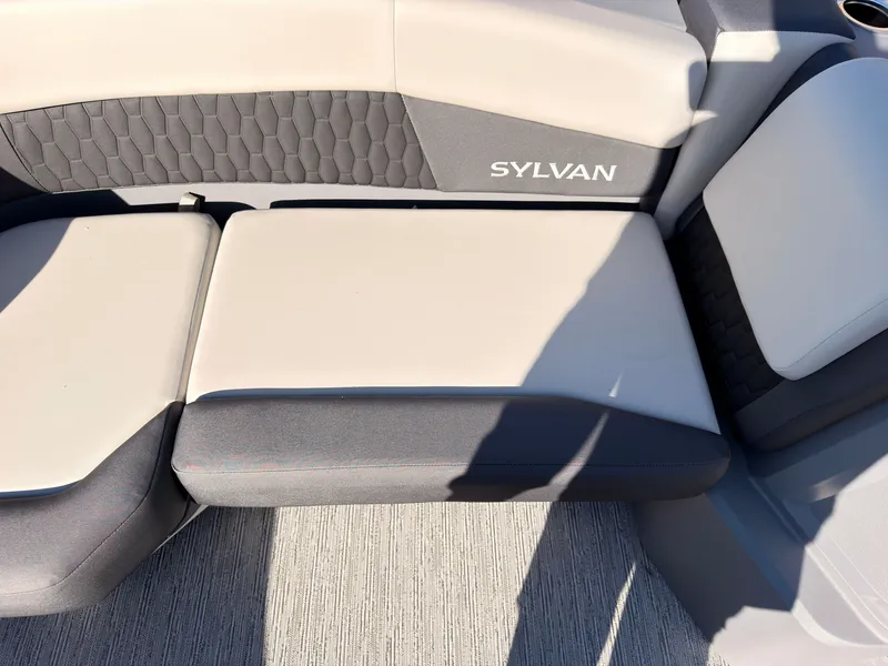 Slide: The Image of The 2027 Sylvan R-20 Q DH features cushioned seating with a modern design. - 19