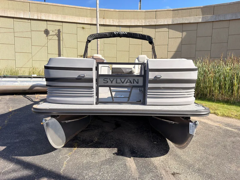 Slide: The Image of The image shows a 2027 Sylvan R-20 Q DH pontoon boat parked on a lot. - 6
