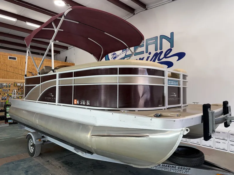 Slide: The Image of 2016 Bennington 20SLX pontoon boat in a workshop. - 17