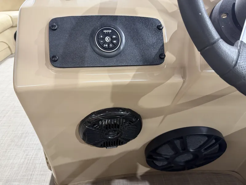 Slide: The Image of 2016 Bennington 20SLX boat console with speakers and controls. - 18