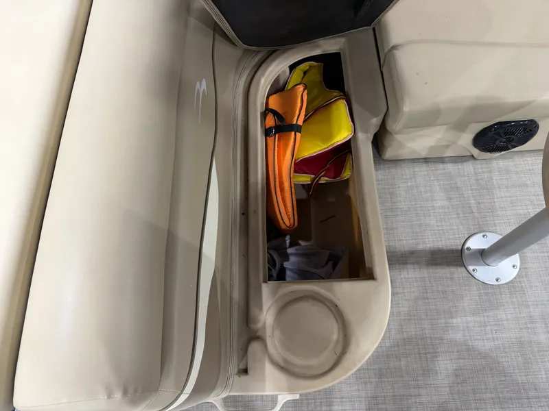 Slide: The Image of Storage compartment in Bennington 20SLX boat with life jackets, year 2016. - 22