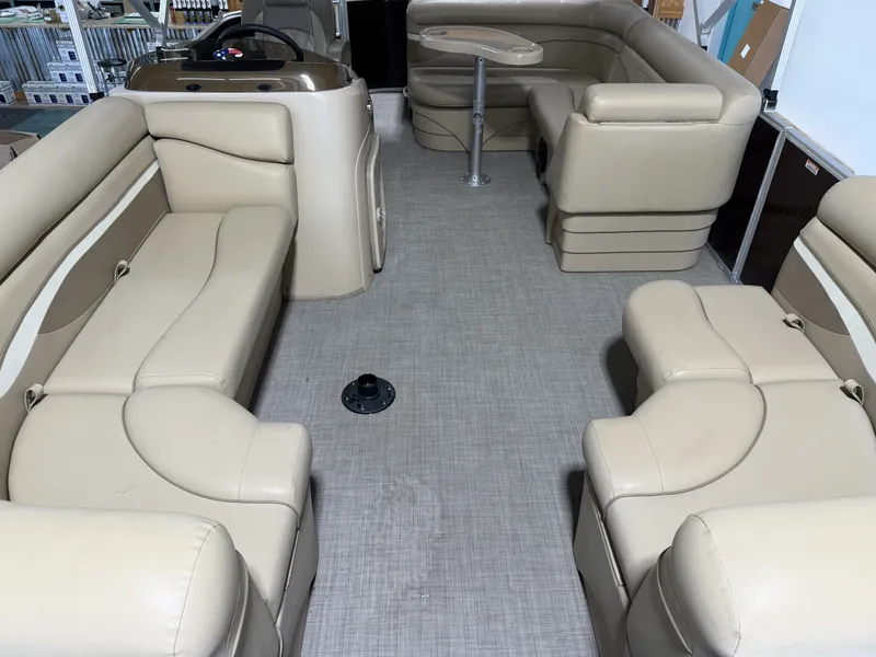 Slide: The Image of Interior of a 2016 Bennington 20SLX pontoon boat with beige seating. - 6