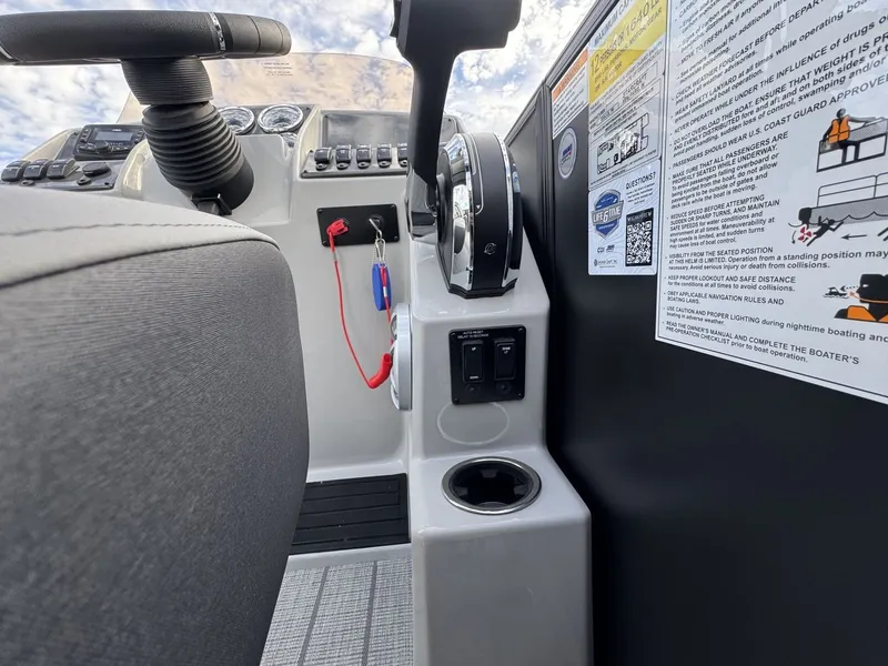Slide: The Image of The image shows the cockpit of a Starcraft EXS 3 DL boat with controls and instruments. - 19
