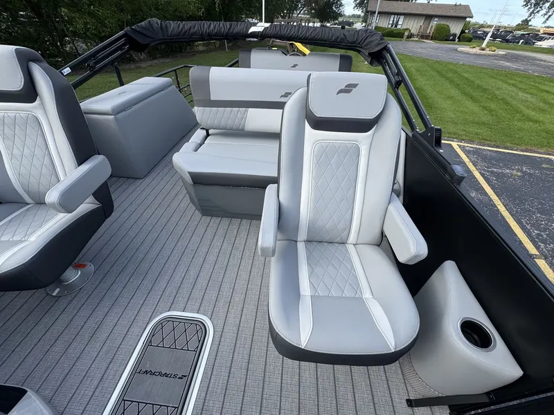 Slide: The Image of The image shows the interior of a 2027 Starcraft EXS 3 DL boat with gray upholstery. - 20