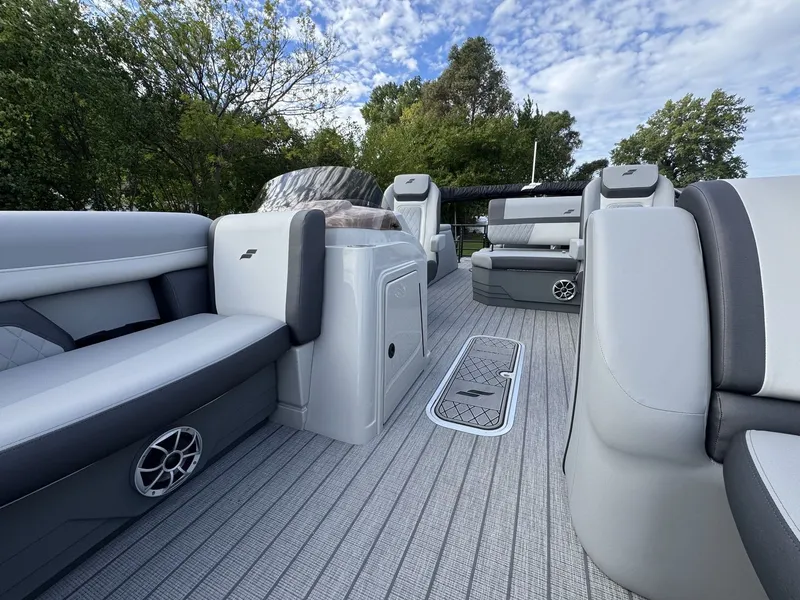 Slide: The Image of The image shows the deck of a 2027 Starcraft EXS 3 DL boat with gray upholstery and modern design. - 28
