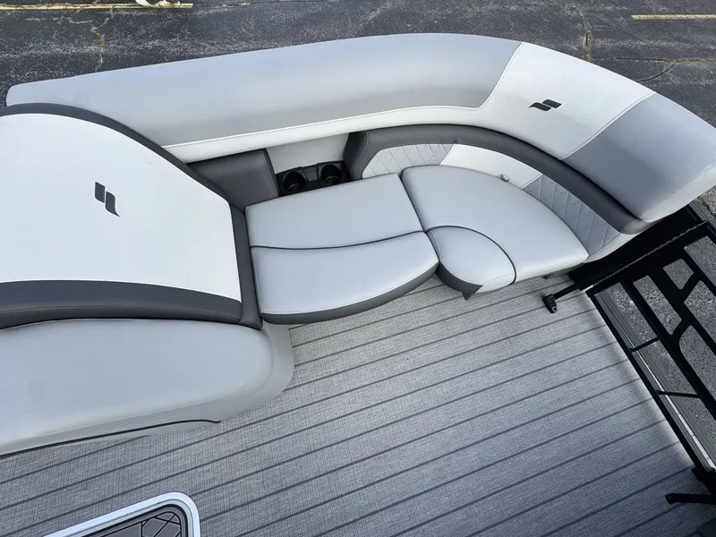 Slide: The Image of The image shows a modern, gray seating area on a boat with sleek upholstery. - 24