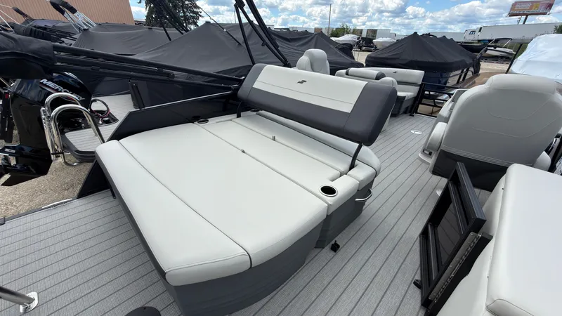 Slide: The Image of The image shows the deck of a Starcraft EX 20 Q DH boat with gray upholstered seats. - 44